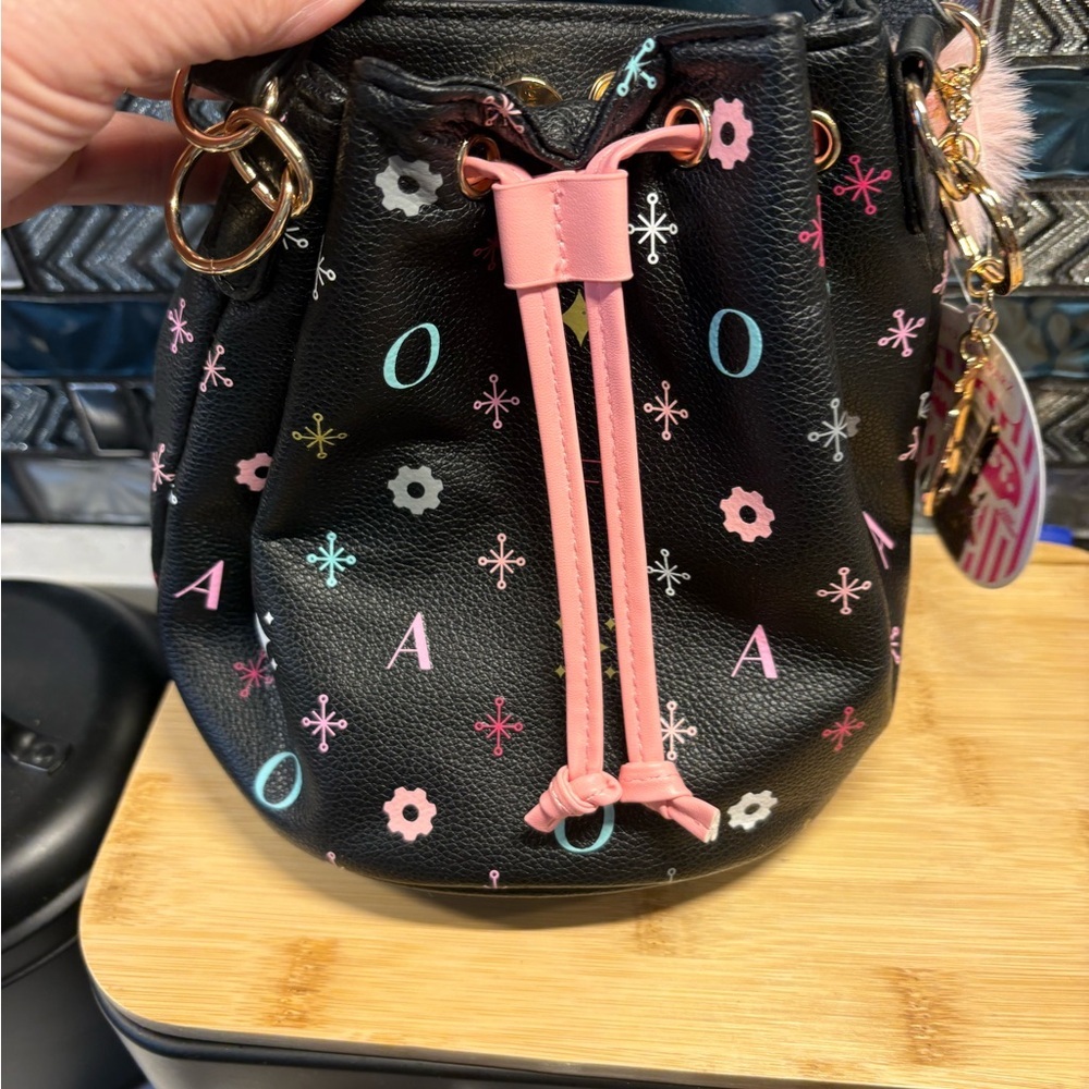 FAO Schwarz Black Drawstring Bucket Bag with Pink Trim and Multicolor Accents